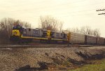 Eastbound vehicle train approaches Alexis